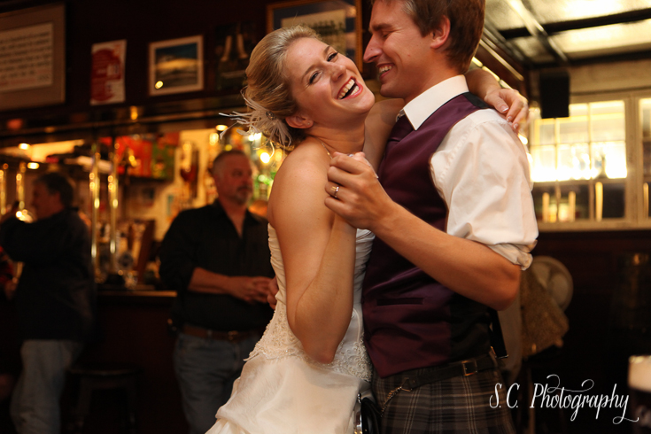 Bride and groom dance in a pub in Edinburgh, Scotland, Scottsman Pub, International Photographer