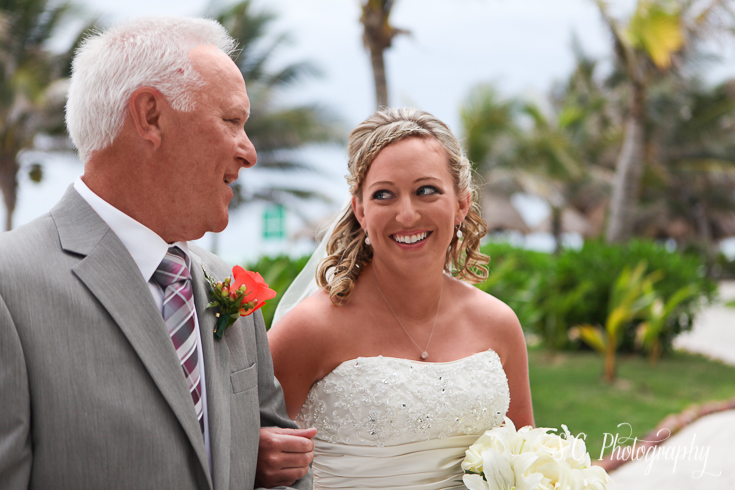 Bride and Father exchange glances before walking down the aisle, Cancun, Mexico Wedding, International PhotographerA tropical reception in Cancun, Mexico, Destination wedding photographer