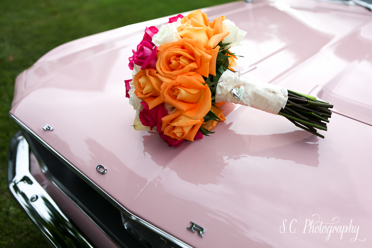 Rose bouquet on pink cadillac