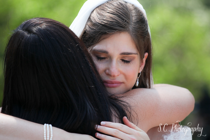 Bride hugging friends. Spring Lake Wedding photographer